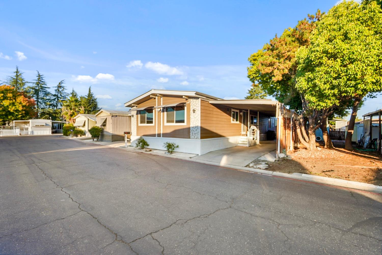 4837 Faith Home Road, Unit 162 Ceres, CA 95307 - Photo 3 of 45 a view of a house with a street