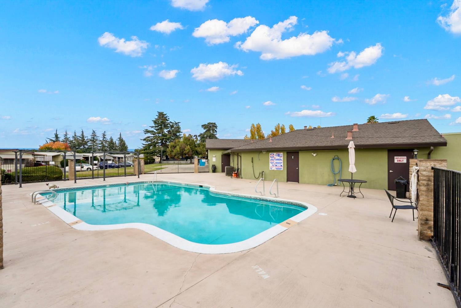 4837 Faith Home Road, Unit 162 Ceres, CA 95307 - Photo 32 of 45 a view of a swimming pool with outdoor seating