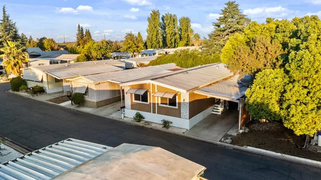 an aerial view of residential building with parking space