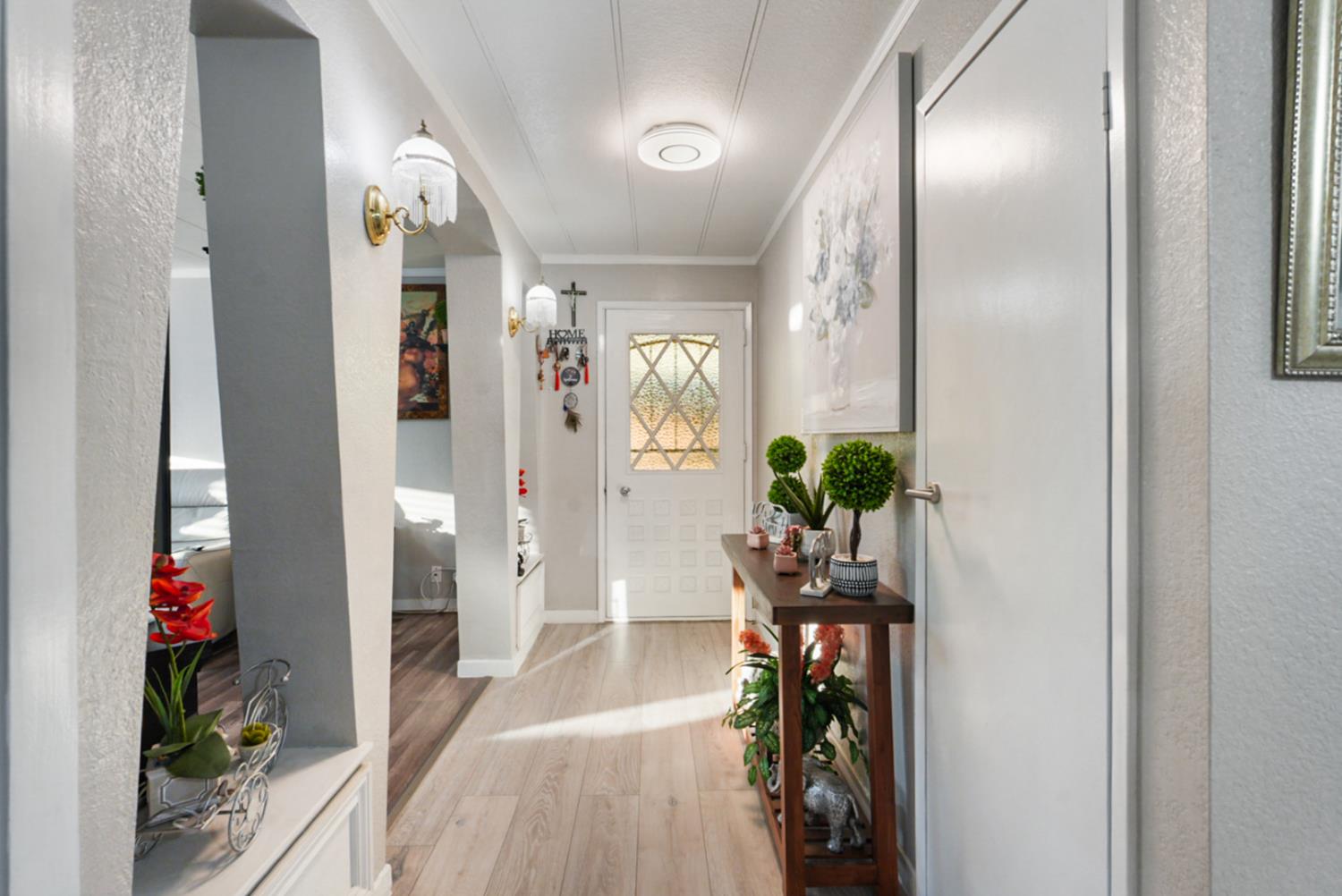 4837 Faith Home Road, Unit 162 Ceres, CA 95307 - Photo 5 of 45 a view of a hallway view with wooden floor and a livingroom view