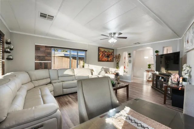 a view of a dining room with furniture and wooden floor