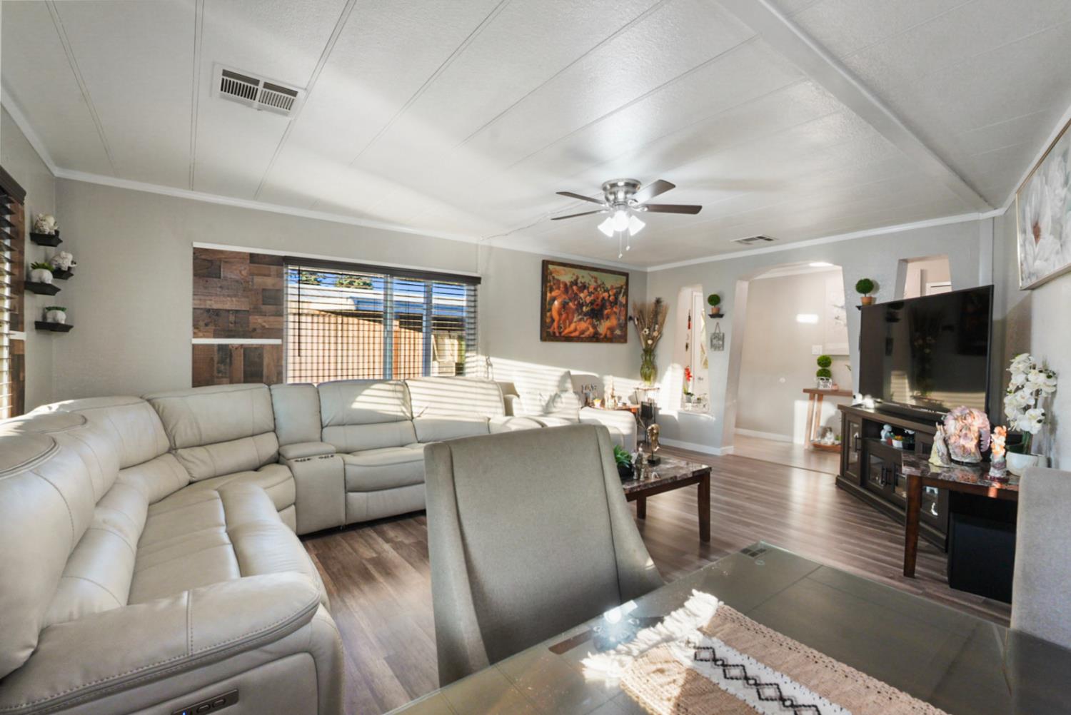 4837 Faith Home Road, Unit 162 Ceres, CA 95307 - Photo 7 of 45 a living room with furniture and a flat screen tv
