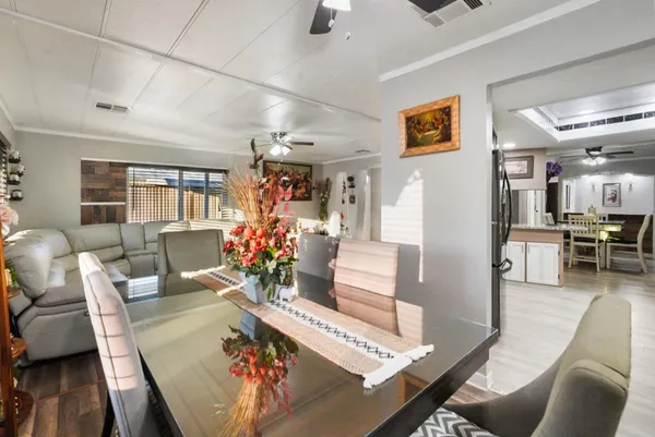 a view of a dining room with furniture window and wooden floor