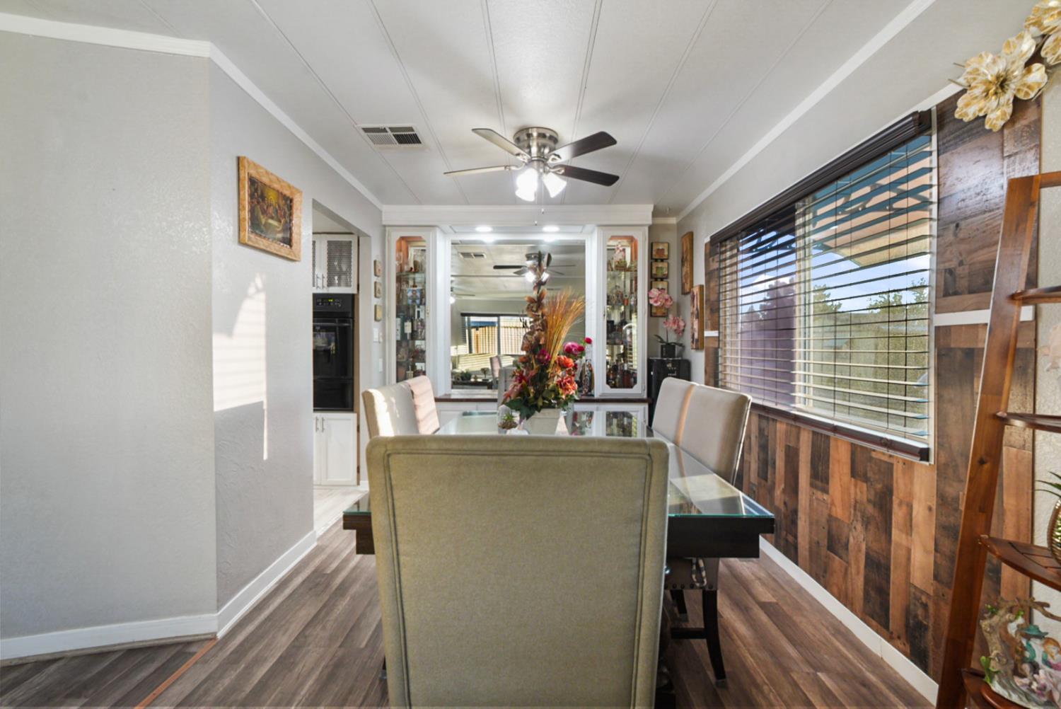4837 Faith Home Road, Unit 162 Ceres, CA 95307 - Photo 10 of 45 a view of a dining room with furniture window and wooden floor