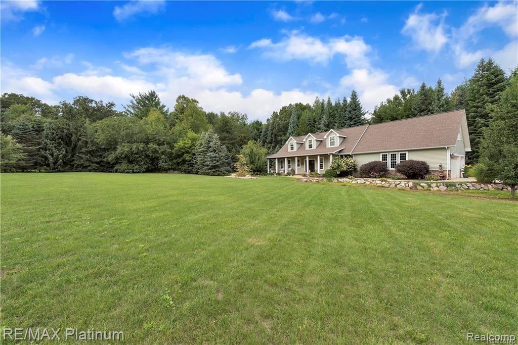 606 South Hacker Road Brighton, MI 48114 - Photo 2 of 42 Tree-Lined Lot with Lush Lawn