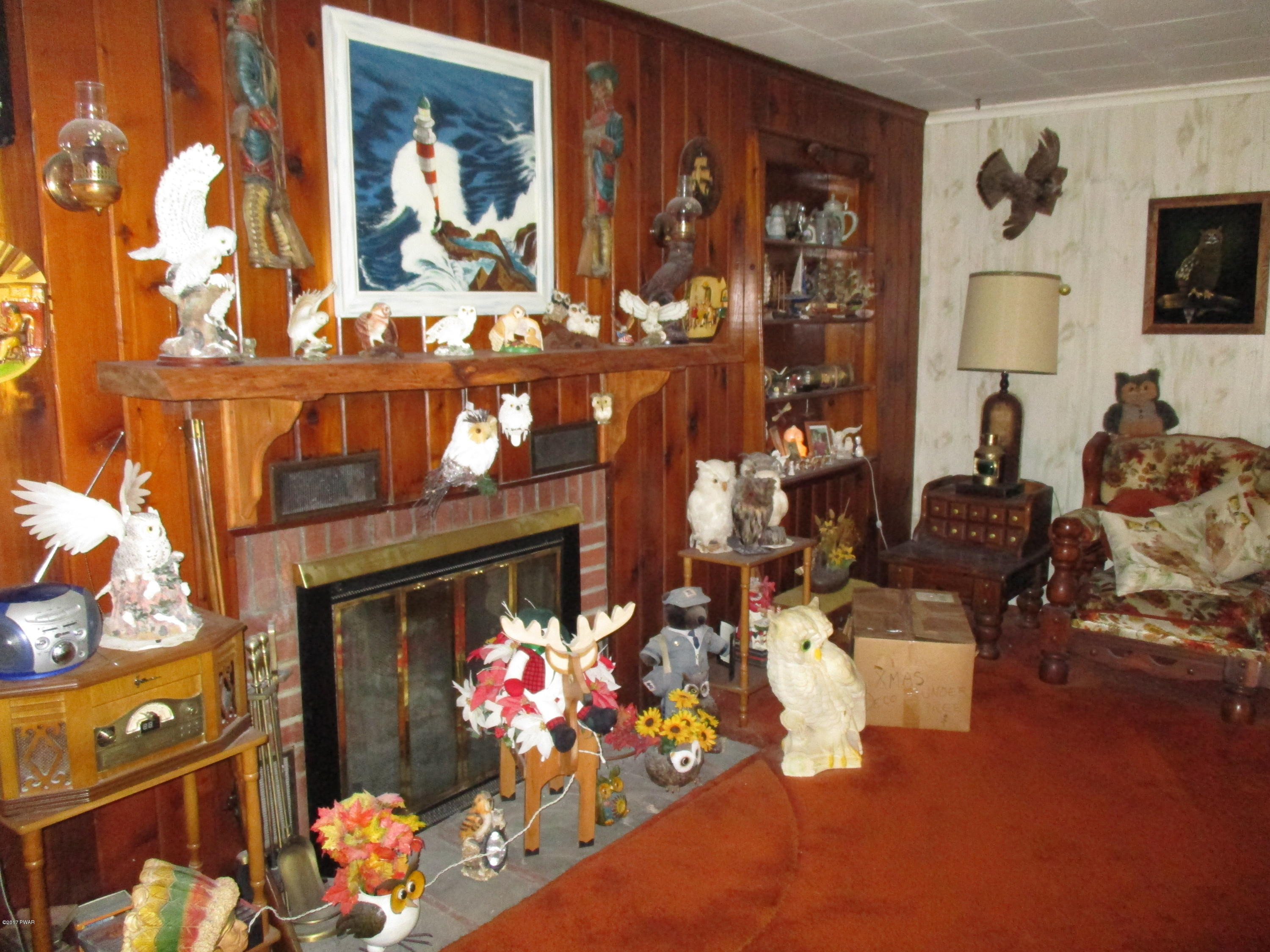 142 Log Tavern Road Milford, PA 18337 - Photo 5 of 24 a living room filled with furniture and flowers