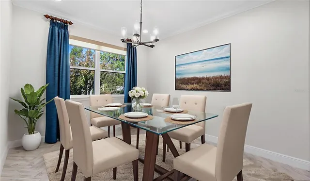 a kitchen with kitchen island a counter top a stove a refrigerator and a sink