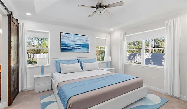 a bedroom with a large bed and a flat screen tv