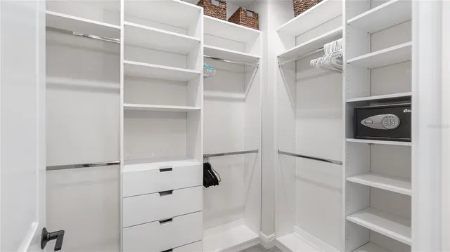 a white toilet sitting next to a bathroom sink