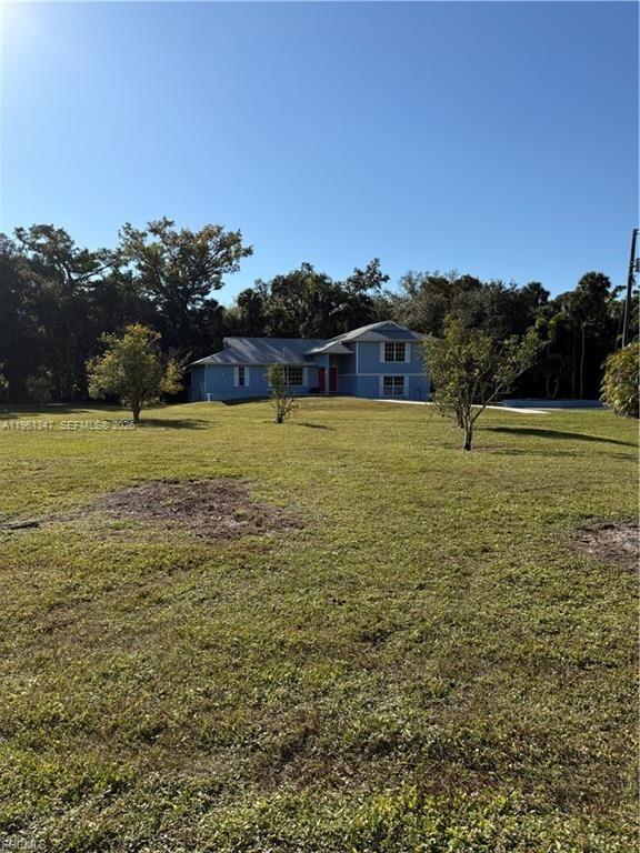 1345 Barrett Road North Fort Myers, FL 33903 - Photo 6 of 27 a view of outdoor space with deck and yard