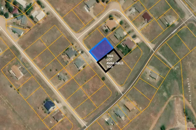 a view of a lake with houses in the back