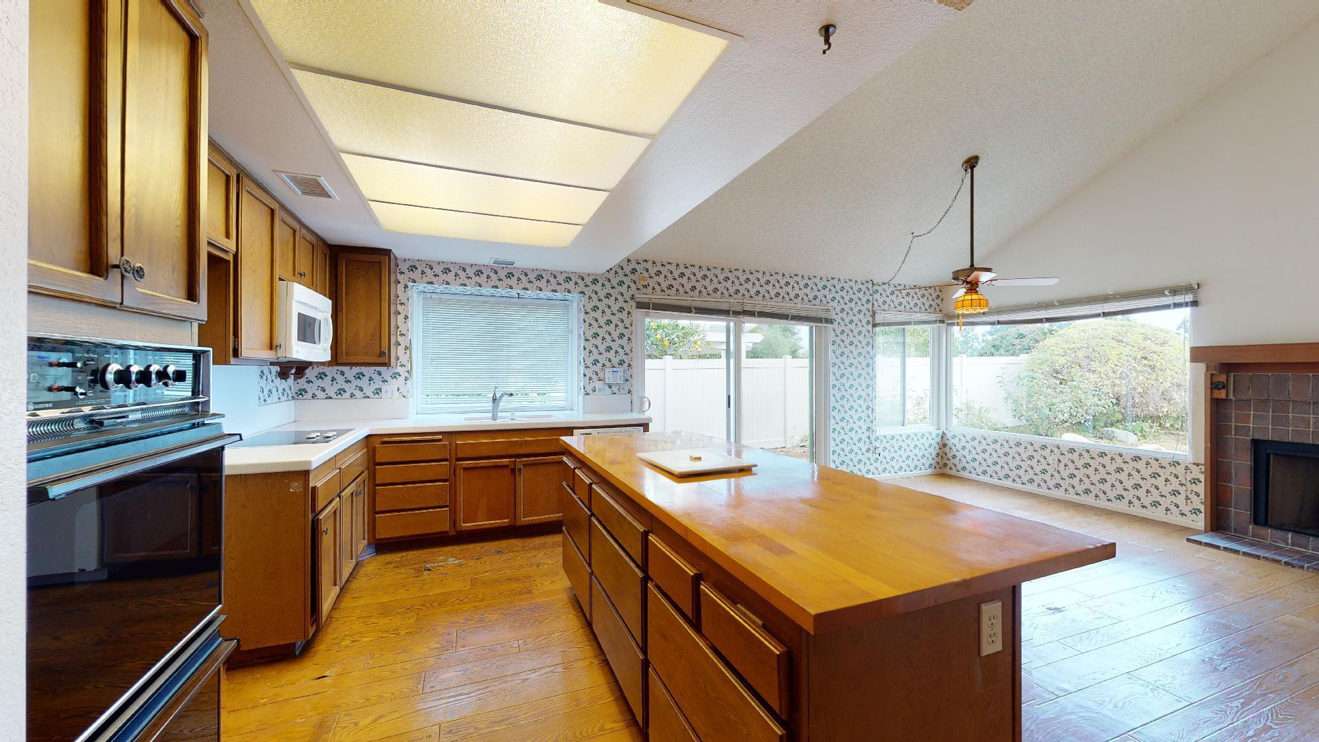8 Elderberry Irvine, CA 92603 - Photo 22 of 59 a kitchen with stainless steel appliances granite countertop a sink and a stove