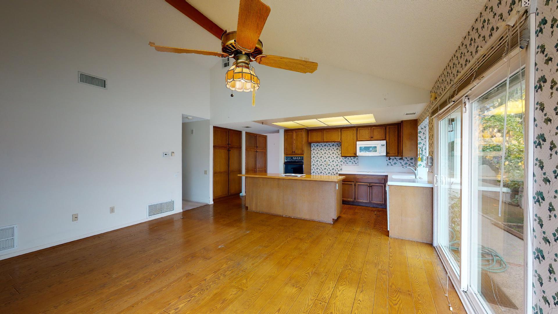 8 Elderberry Irvine, CA 92603 - Photo 25 of 59 a view of kitchen and dining area with a large window