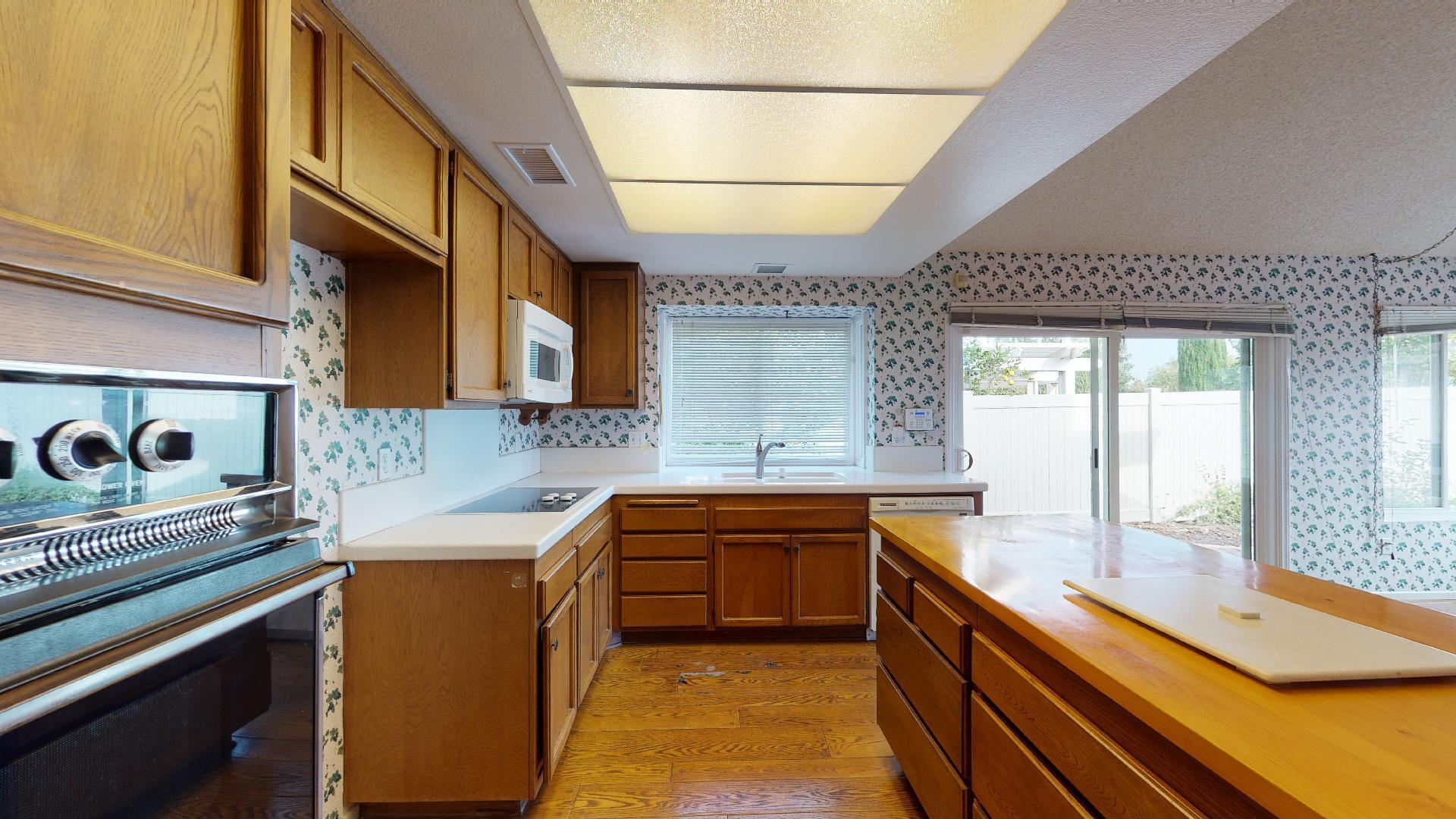8 Elderberry Irvine, CA 92603 - Photo 31 of 59 a kitchen with stainless steel appliances granite countertop sink stove and cabinets