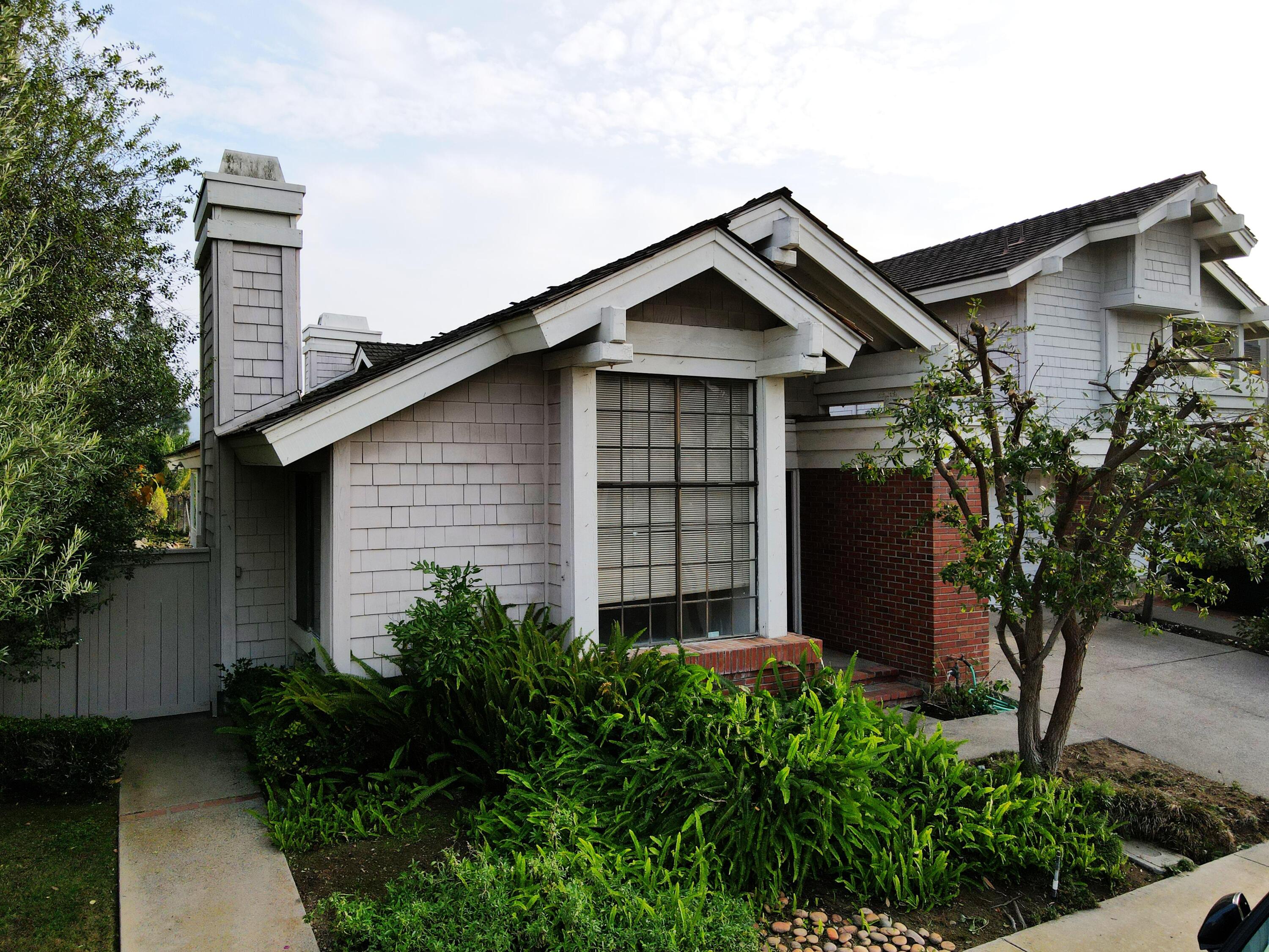 8 Elderberry Irvine, CA 92603 - Photo 4 of 59 a front view of a house with garden