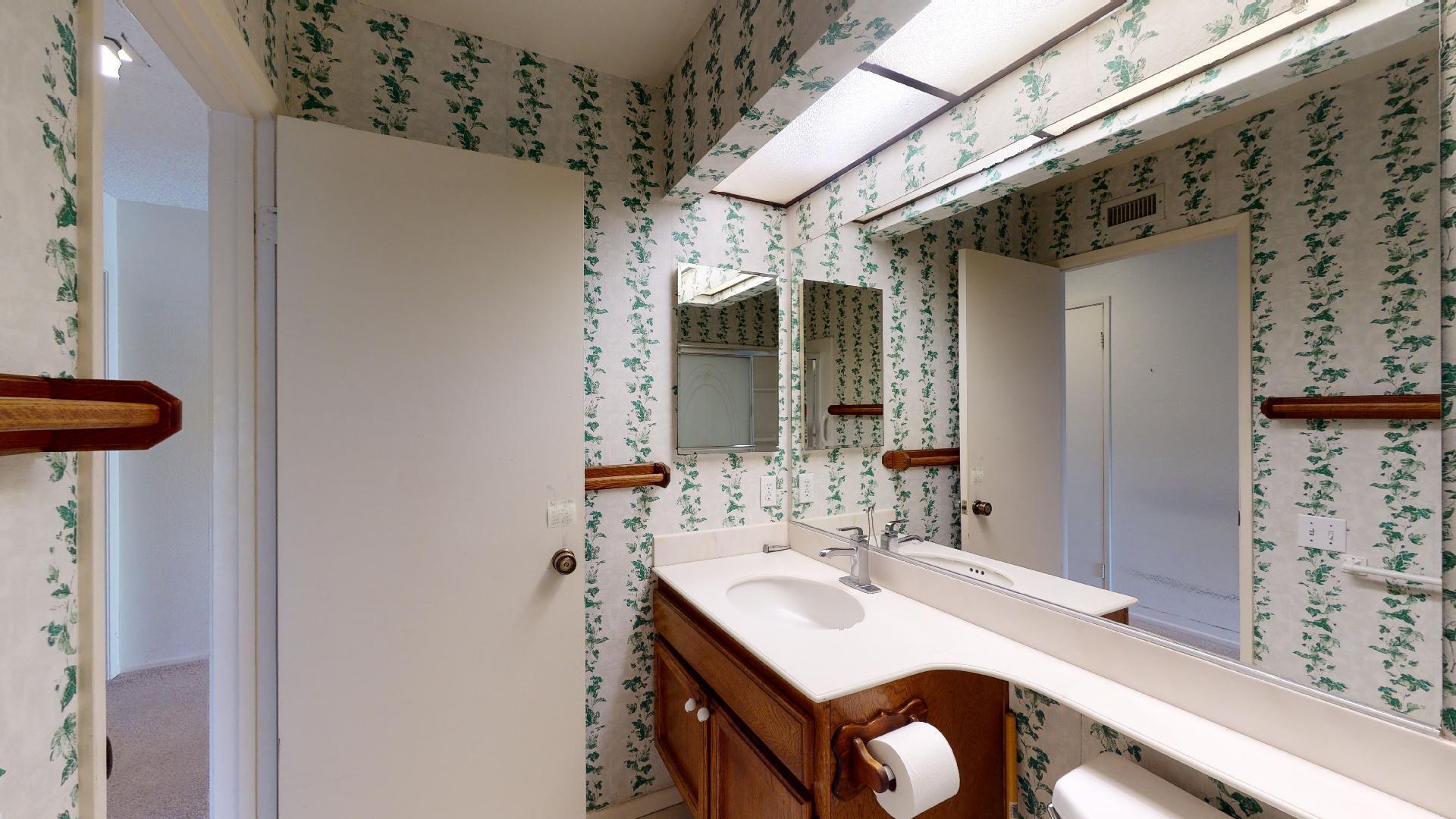 8 Elderberry Irvine, CA 92603 - Photo 41 of 59 a bathroom with a sink a mirror and a shower