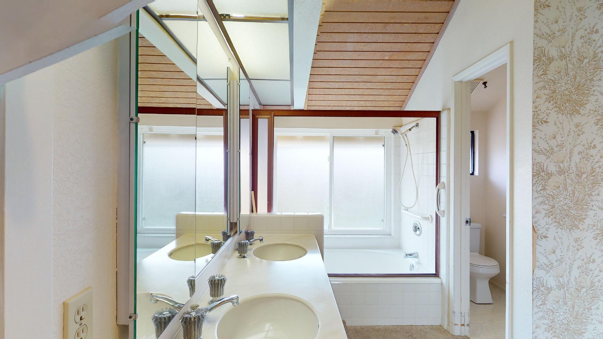 8 Elderberry Irvine, CA 92603 - Photo 49 of 59 a bathroom with a sink a toilet and mirror