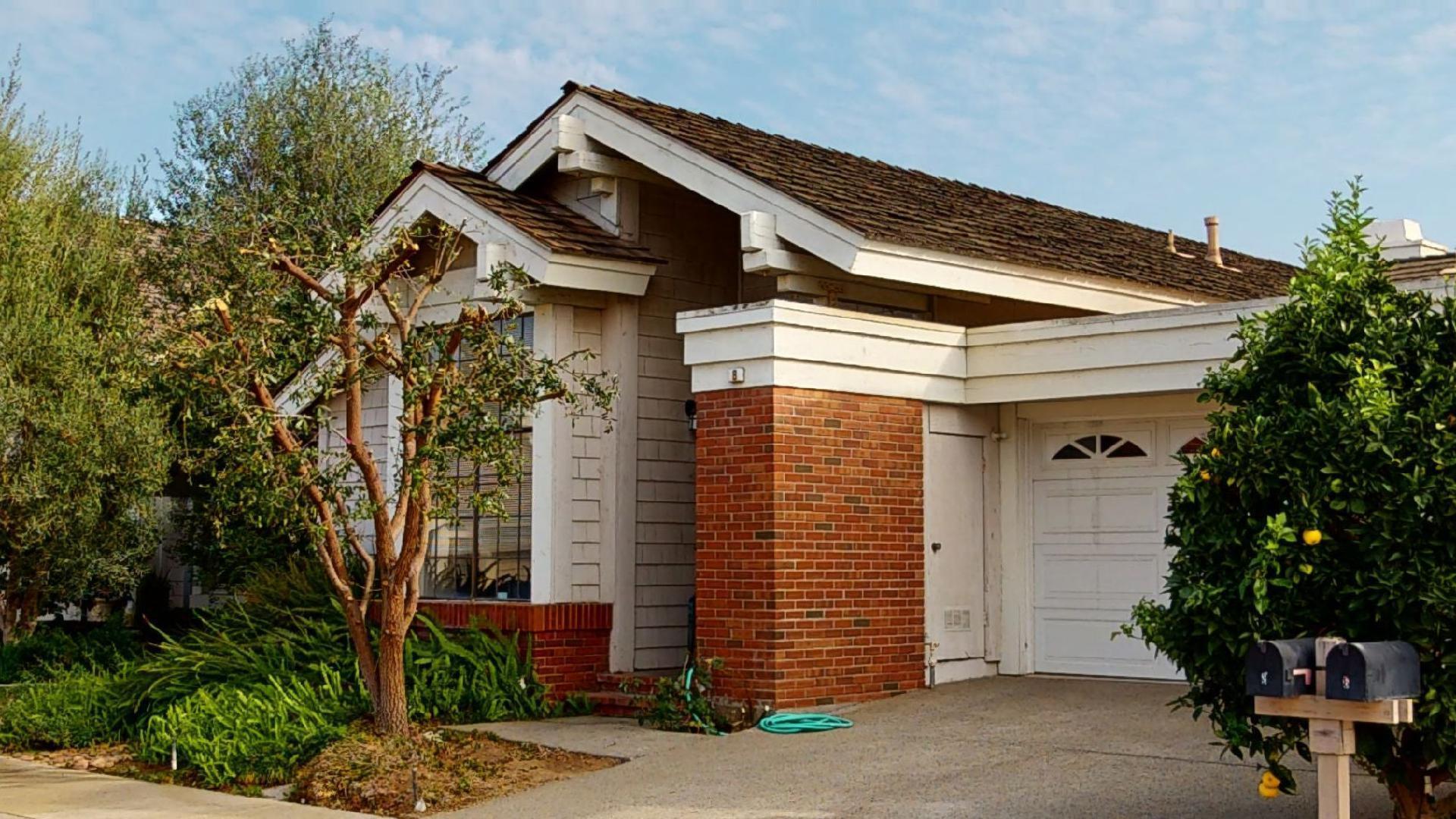 8 Elderberry Irvine, CA 92603 - Photo 51 of 59 a front view of a house with garden
