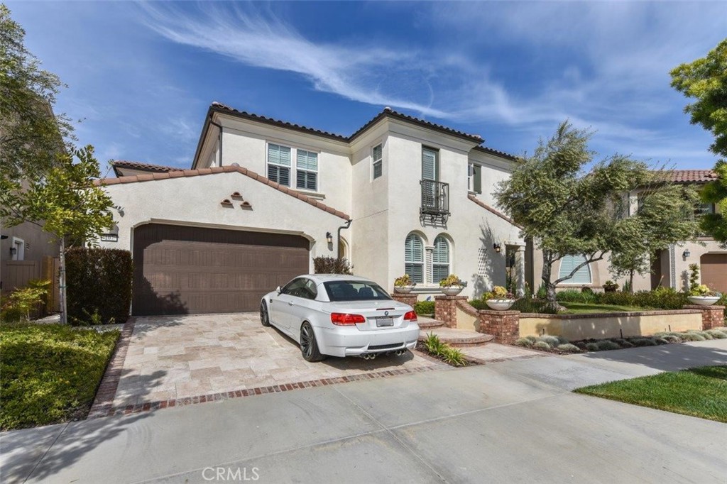 a car parked in front of white house