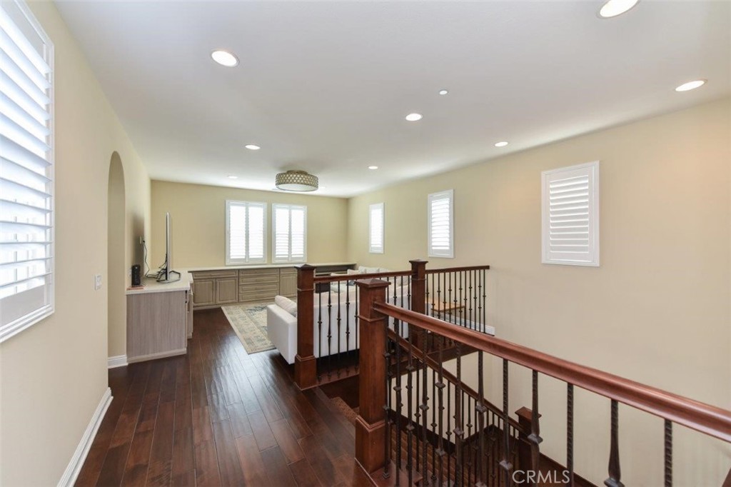 107 Fairgrove Irvine, CA 92618 - Photo 12 of 31 a view of a hallway with wooden floor and windows