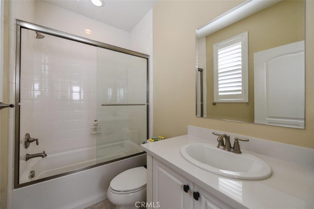 107 Fairgrove Irvine, CA 92618 - Photo 13 of 31 a bathroom with a sink a toilet and shower