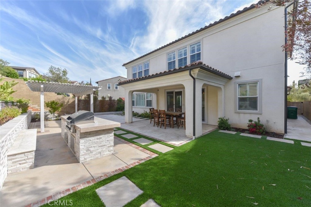 107 Fairgrove Irvine, CA 92618 - Photo 23 of 31 a front view of house with yard and outdoor seating