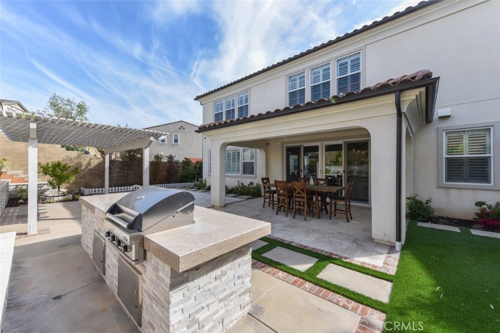 107 Fairgrove Irvine, CA 92618 - Photo 24 of 31 a view of a dinning table and chairs in patio