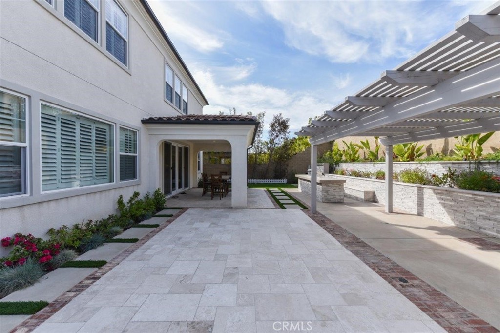 107 Fairgrove Irvine, CA 92618 - Photo 28 of 31 a house with garden in front of it