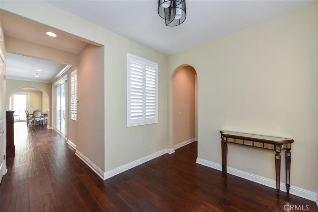 107 Fairgrove Irvine, CA 92618 - Photo 4 of 31 a view of empty room with wooden floor and fan