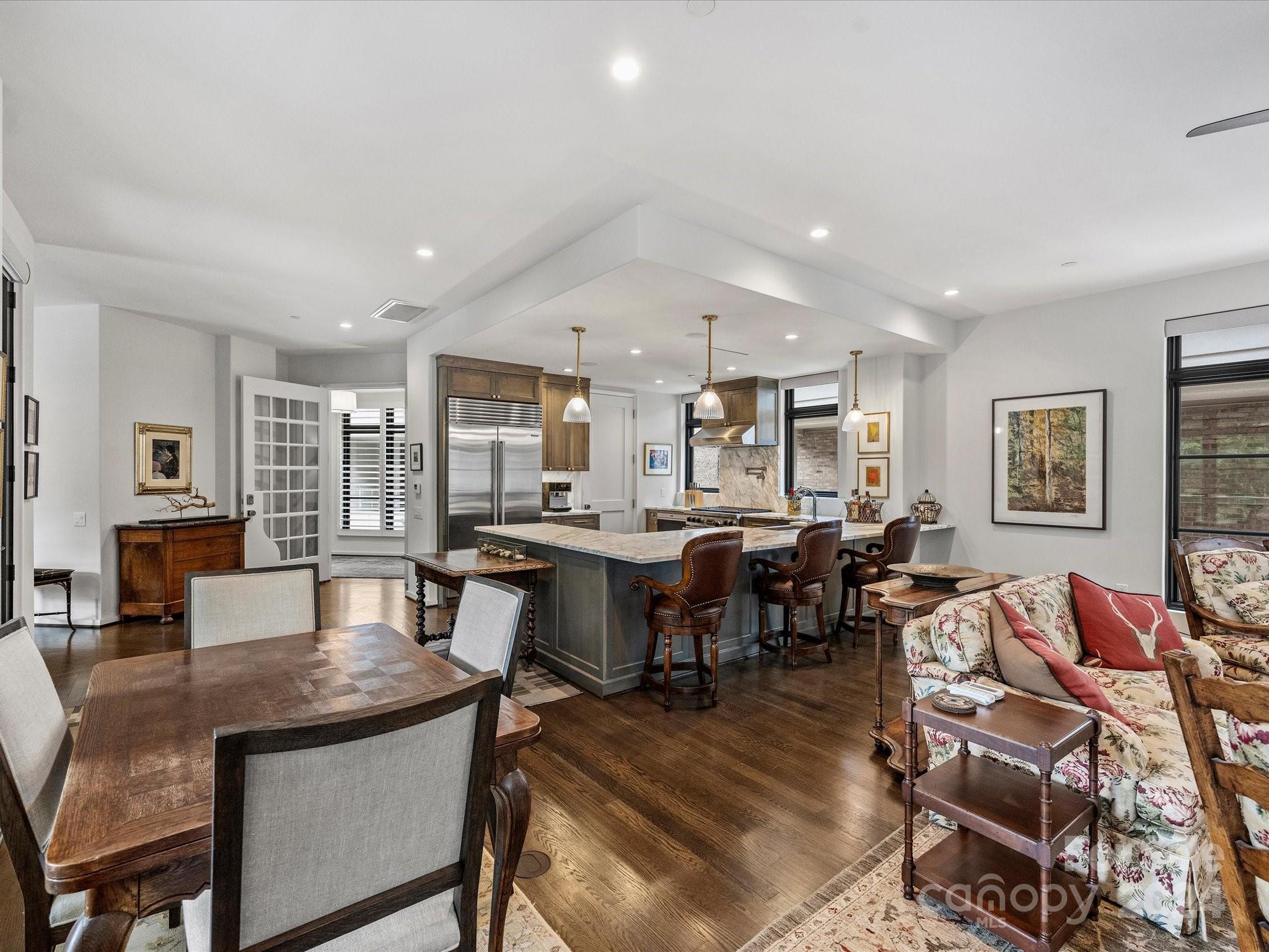 1333 Queens Road, Unit E3 Charlotte, NC 28207 - Photo 11 of 42 a view of a dining room with furniture