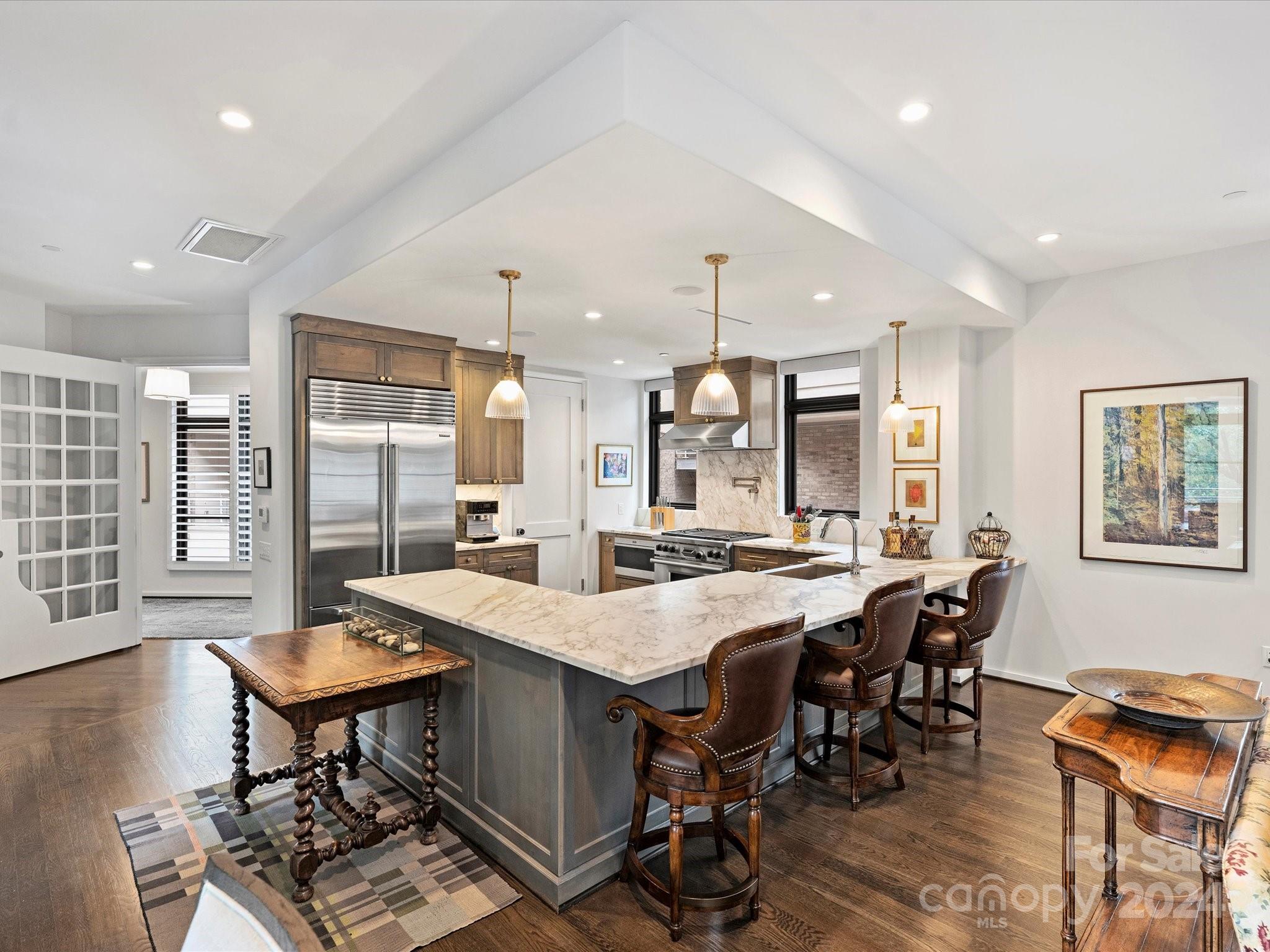 1333 Queens Road, Unit E3 Charlotte, NC 28207 - Photo 12 of 42 a view of a dining room with furniture and wooden floor