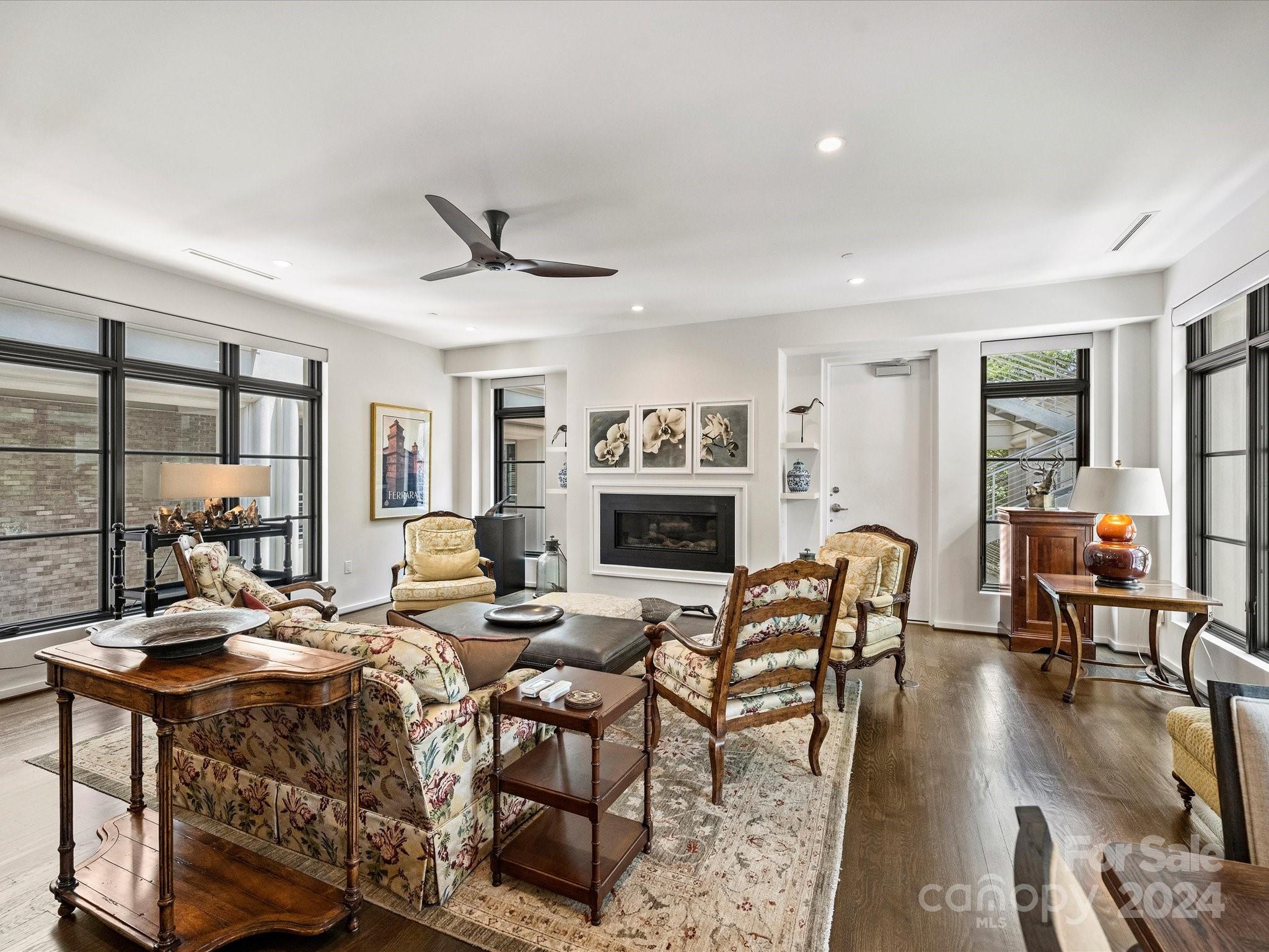 1333 Queens Road, Unit E3 Charlotte, NC 28207 - Photo 17 of 42 a living room with fireplace furniture and a wooden floor