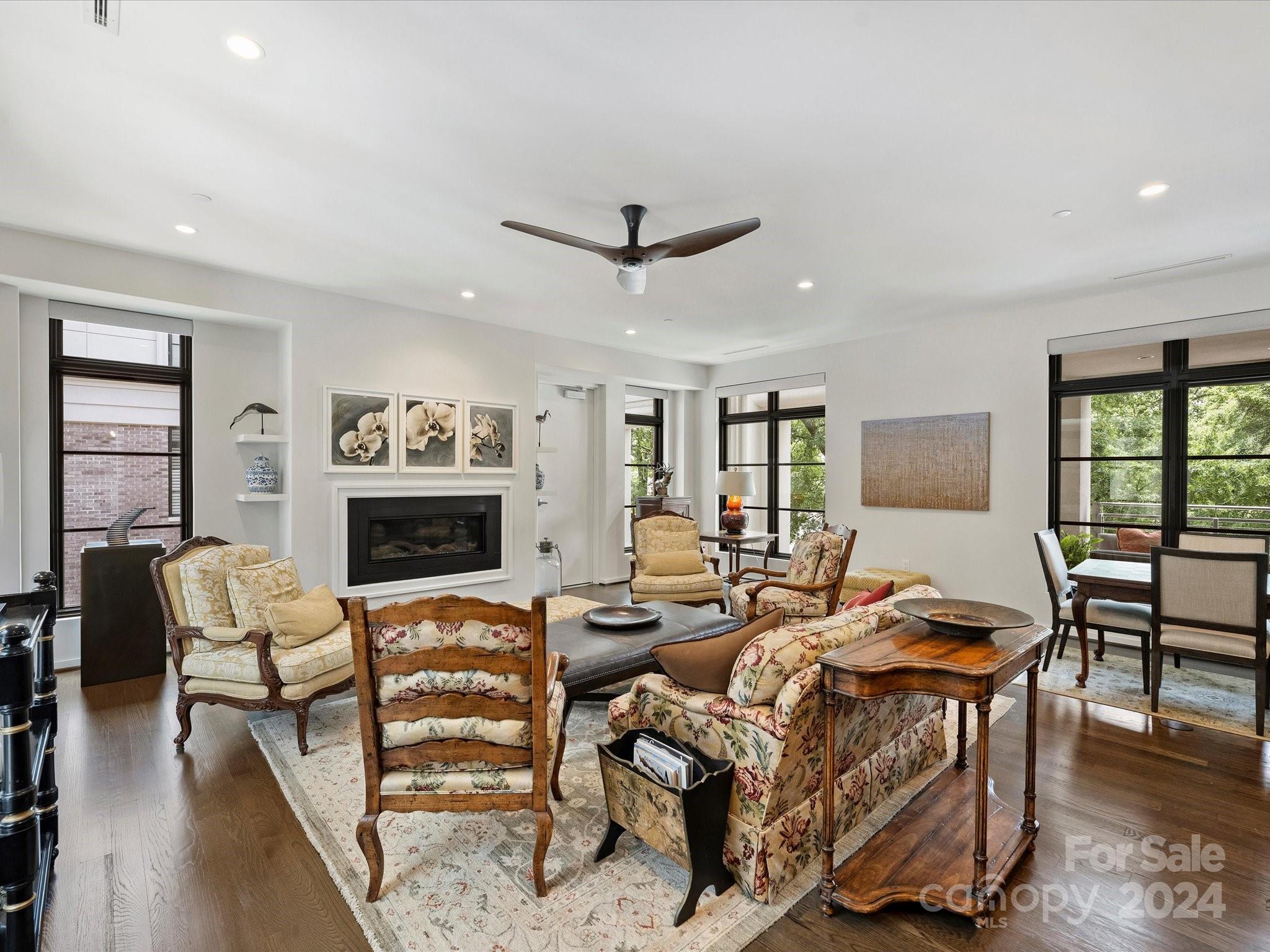 1333 Queens Road, Unit E3 Charlotte, NC 28207 - Photo 18 of 42 a living room with furniture a fireplace and a flat screen tv