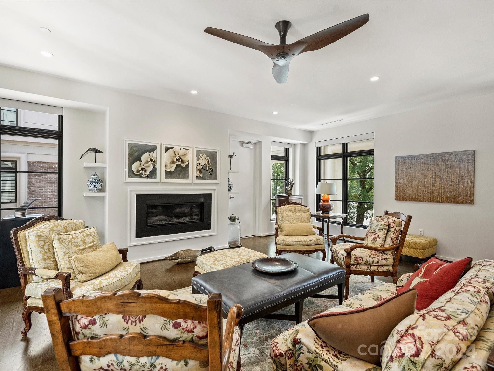 1333 Queens Road, Unit E3 Charlotte, NC 28207 - Photo 19 of 42 a living room with furniture and a fireplace