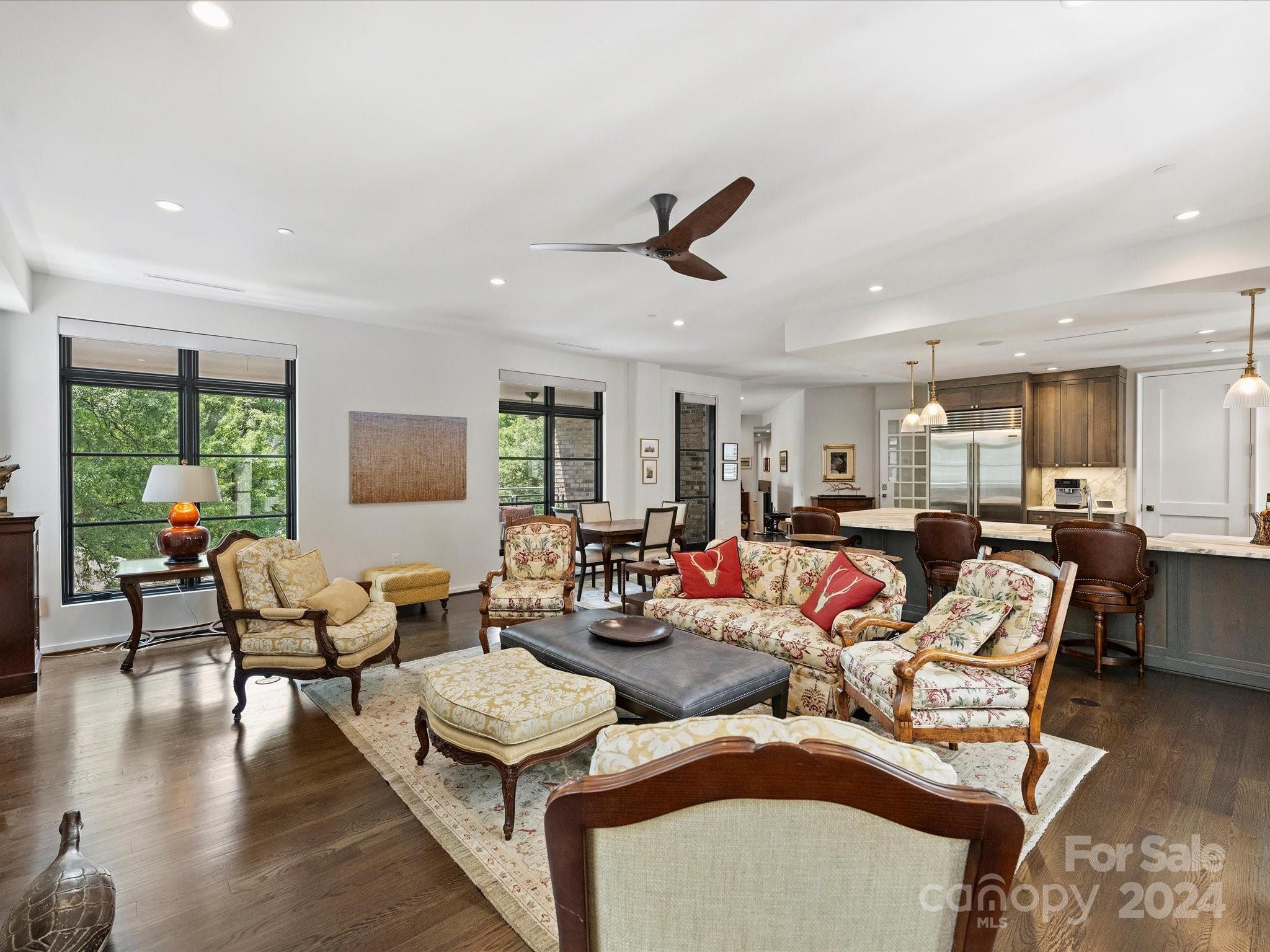 1333 Queens Road, Unit E3 Charlotte, NC 28207 - Photo 20 of 42 a living room with furniture wooden floor and a large window