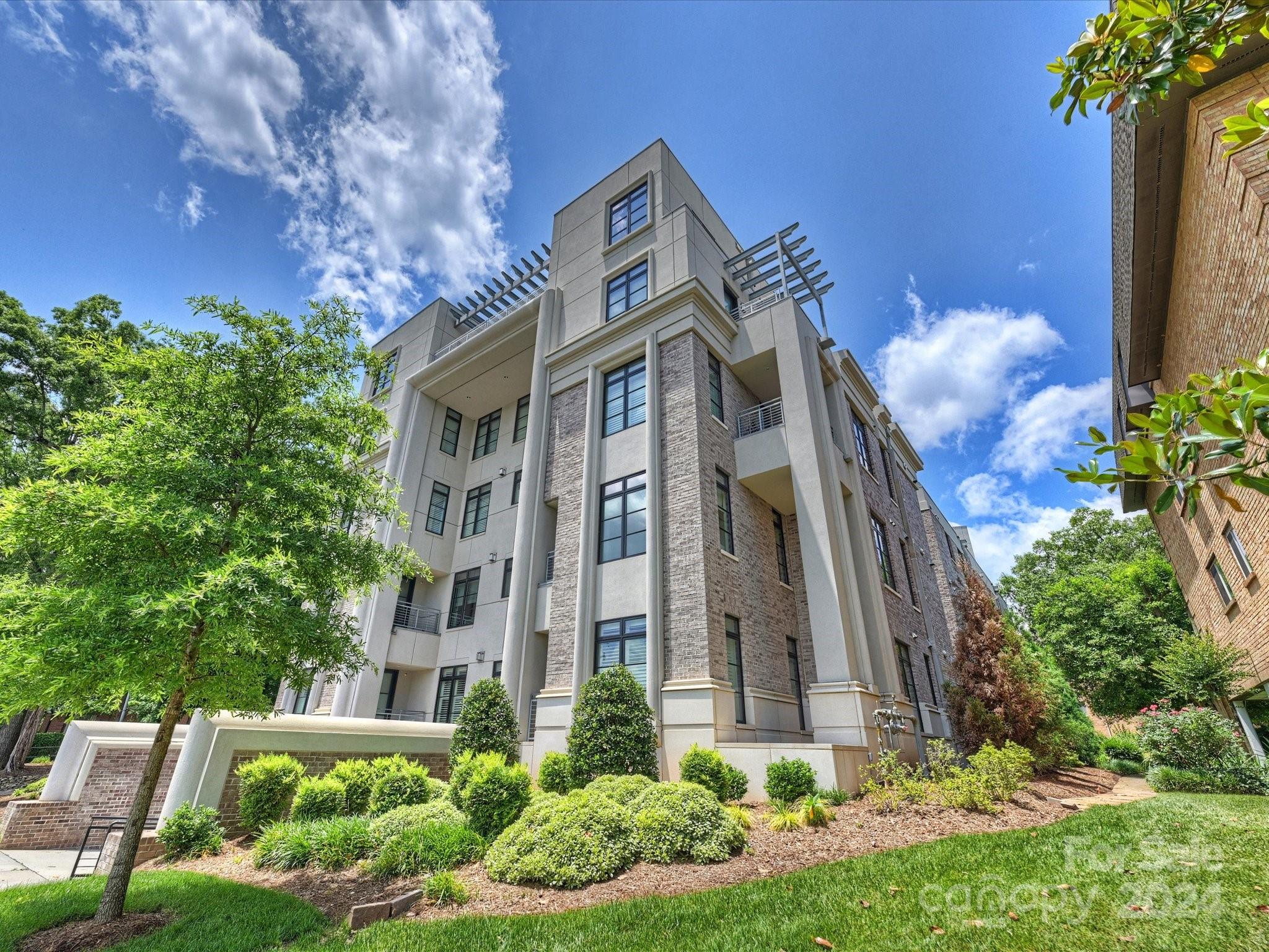 1333 Queens Road, Unit E3 Charlotte, NC 28207 - Photo 2 of 42 a front view of a multi story residential apartment building