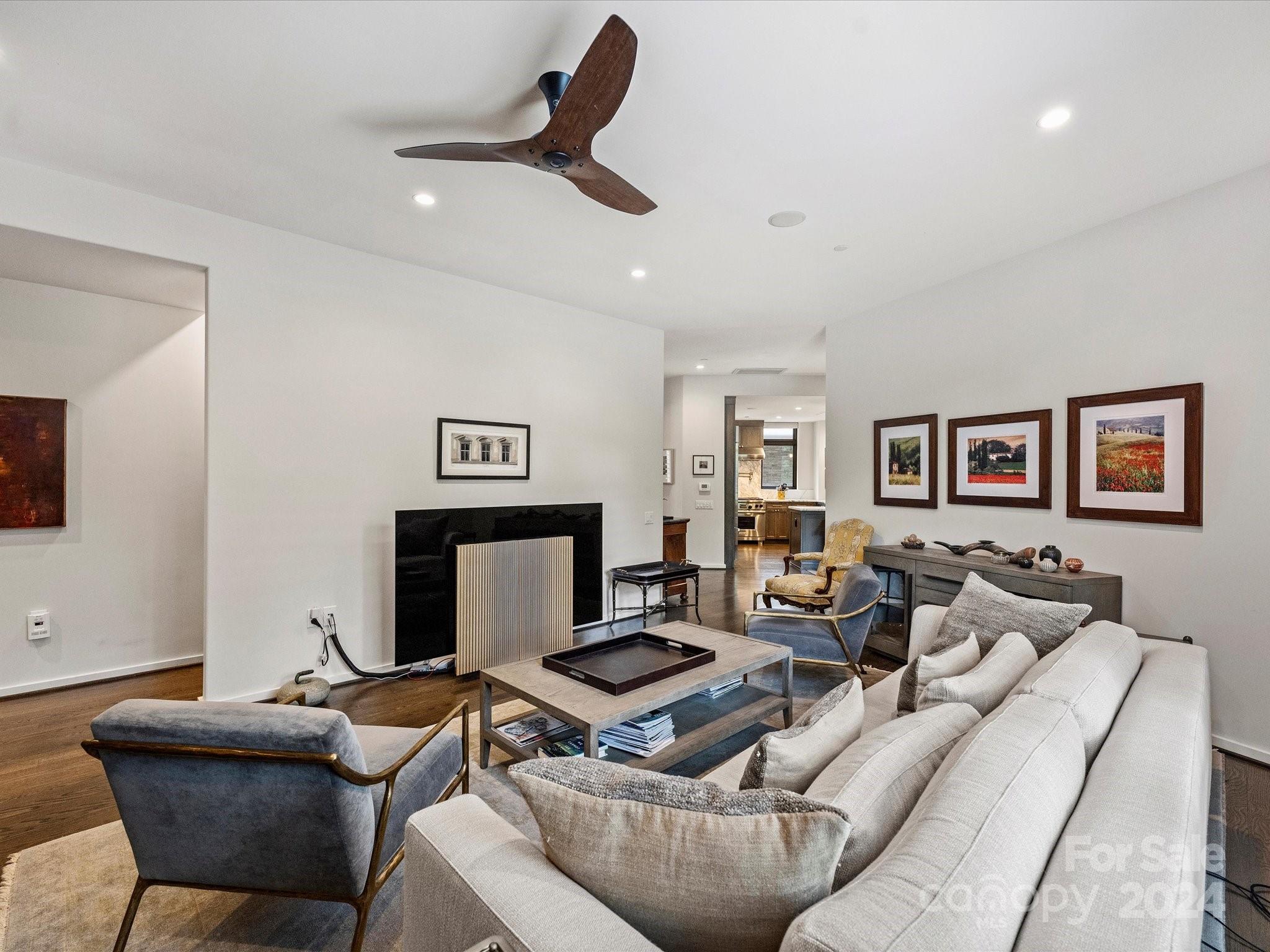 1333 Queens Road, Unit E3 Charlotte, NC 28207 - Photo 24 of 42 a living room with furniture and a flat screen tv