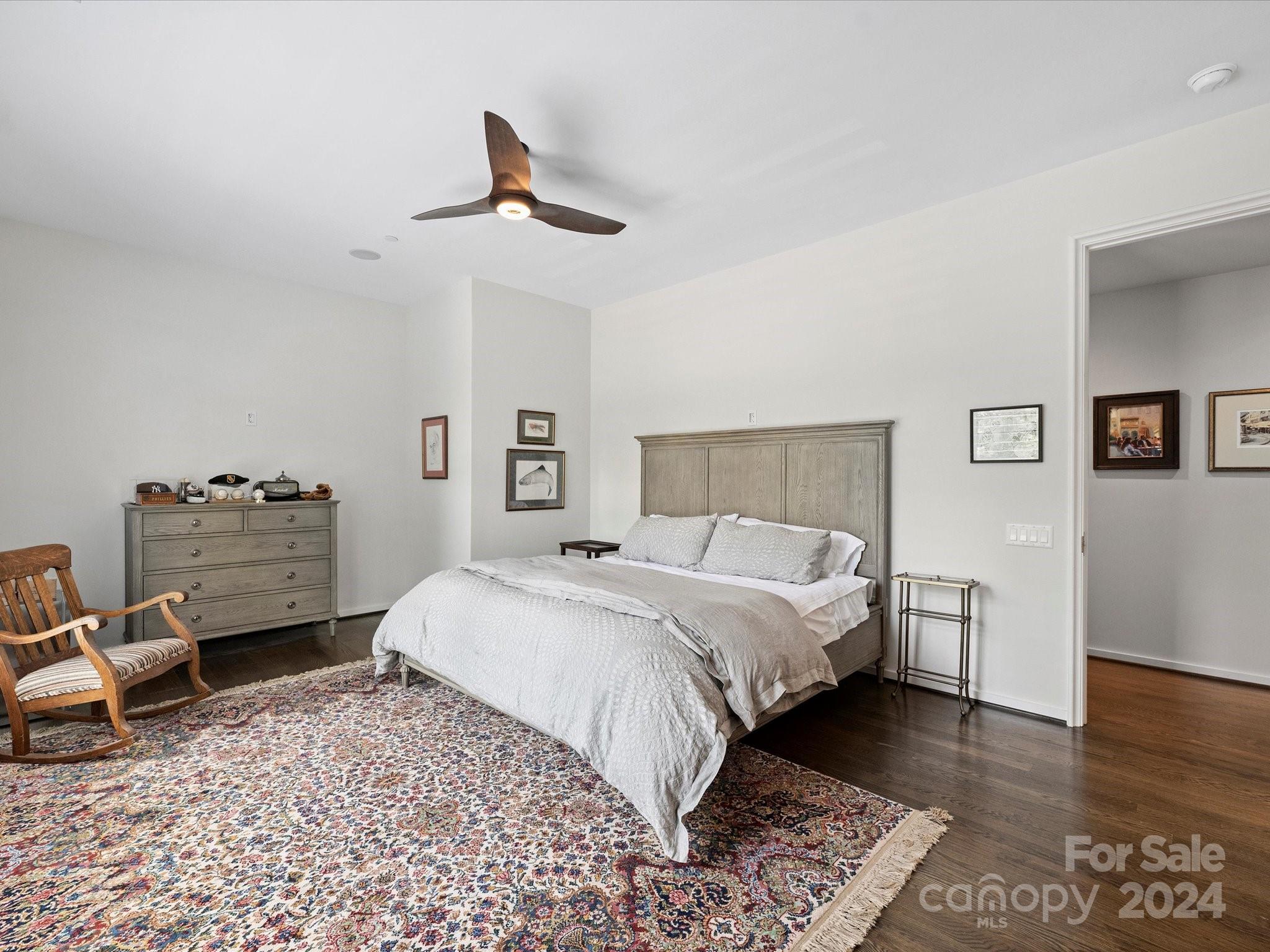 1333 Queens Road, Unit E3 Charlotte, NC 28207 - Photo 26 of 42 a bedroom with a bed and wooden floor