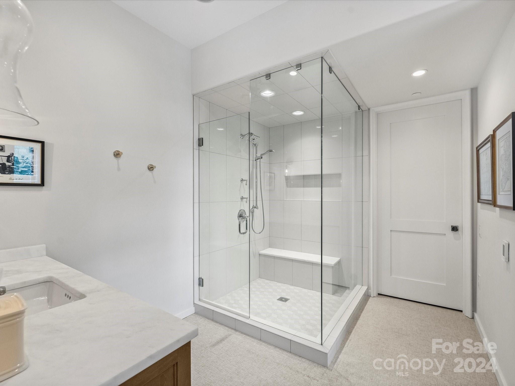 1333 Queens Road, Unit E3 Charlotte, NC 28207 - Photo 29 of 42 a bathroom with a shower and sink