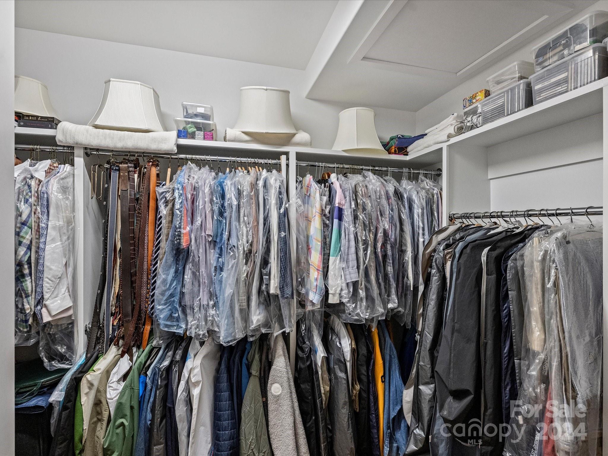1333 Queens Road, Unit E3 Charlotte, NC 28207 - Photo 32 of 42 a view of walk in closet with clothes and shoes