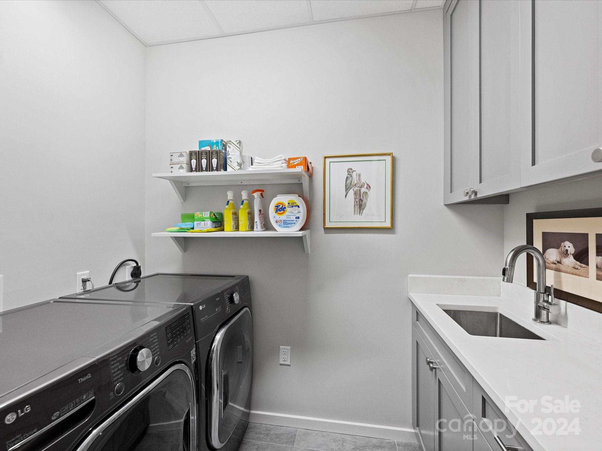 1333 Queens Road, Unit E3 Charlotte, NC 28207 - Photo 40 of 42 a kitchen with stainless steel appliances granite countertop a sink and a stove top oven