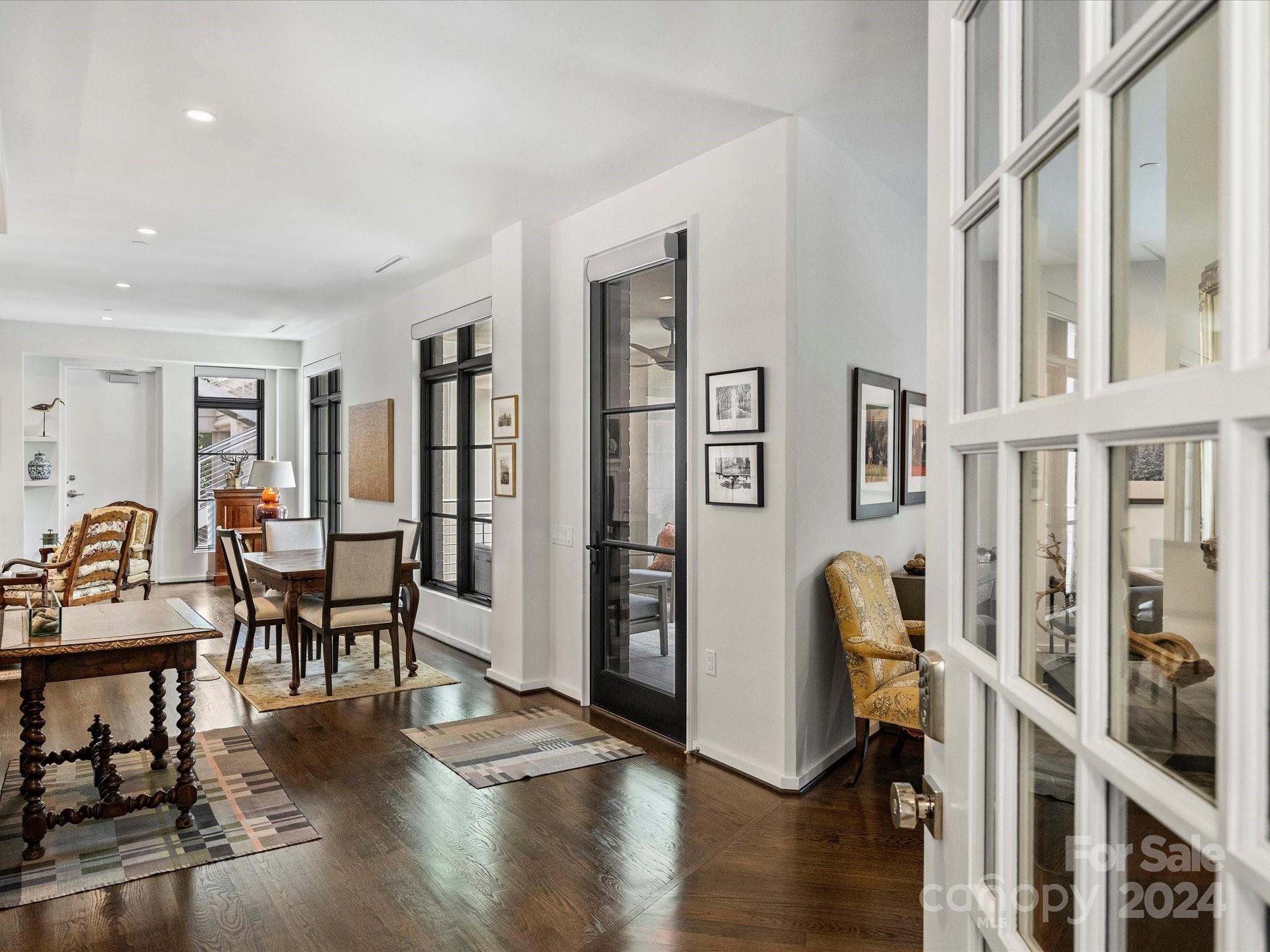 1333 Queens Road, Unit E3 Charlotte, NC 28207 - Photo 7 of 42 a living room with furniture and wooden floor