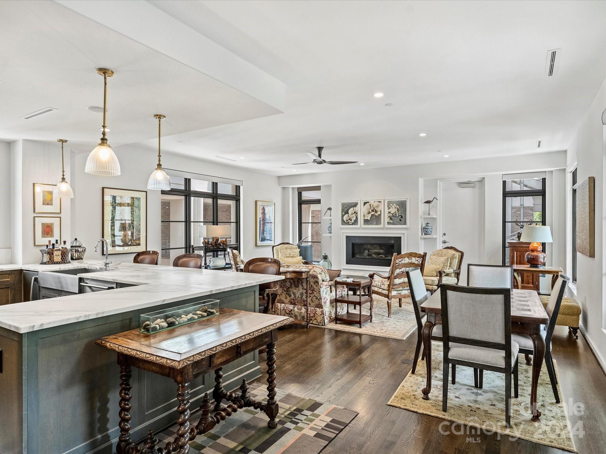 1333 Queens Road, Unit E3 Charlotte, NC 28207 - Photo 9 of 42 a view of a dining room with furniture window and wooden floor