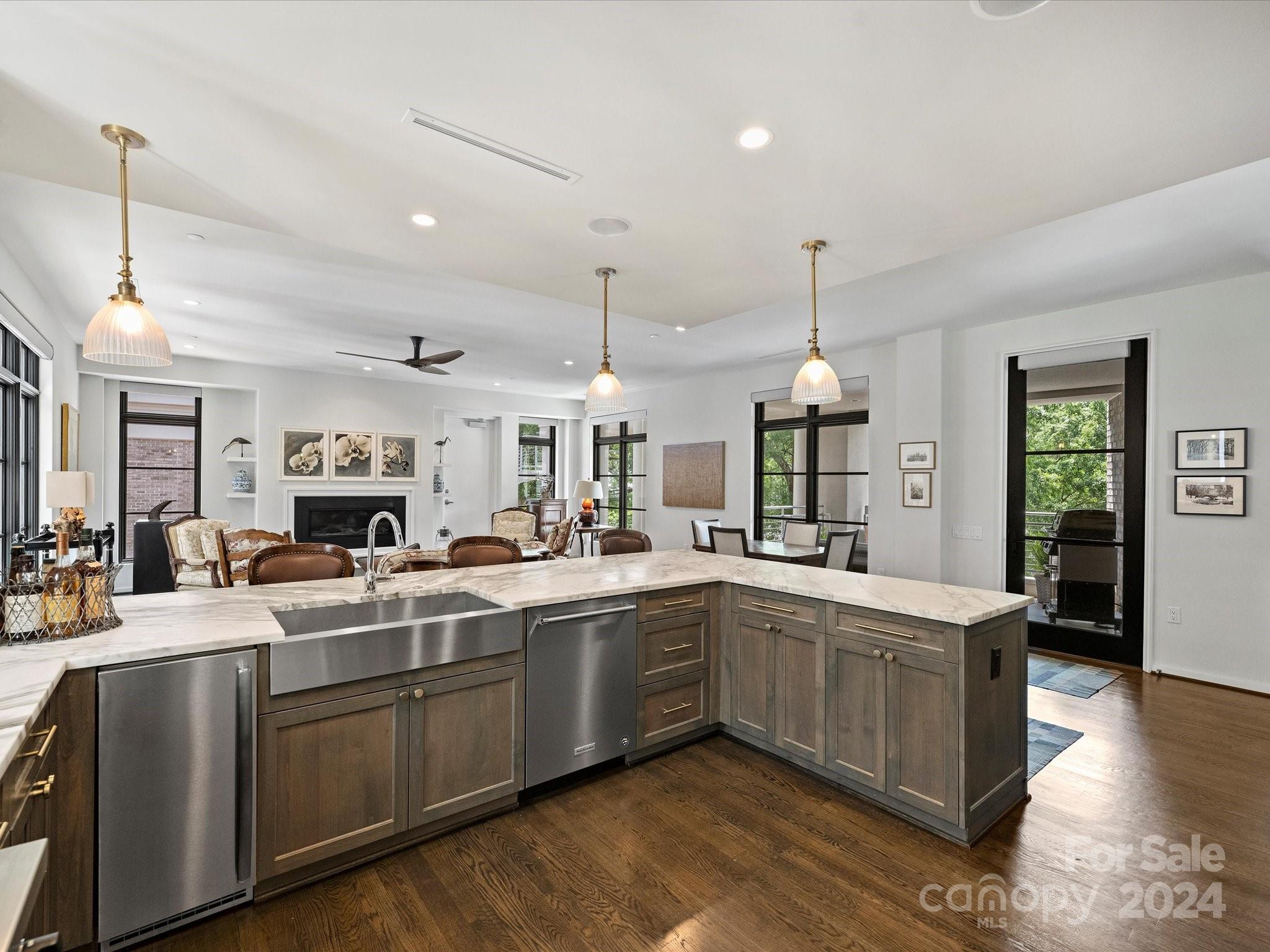 1333 Queens Road, Unit E3 Charlotte, NC 28207 - Photo 10 of 42 a large white kitchen with sink and cabinets