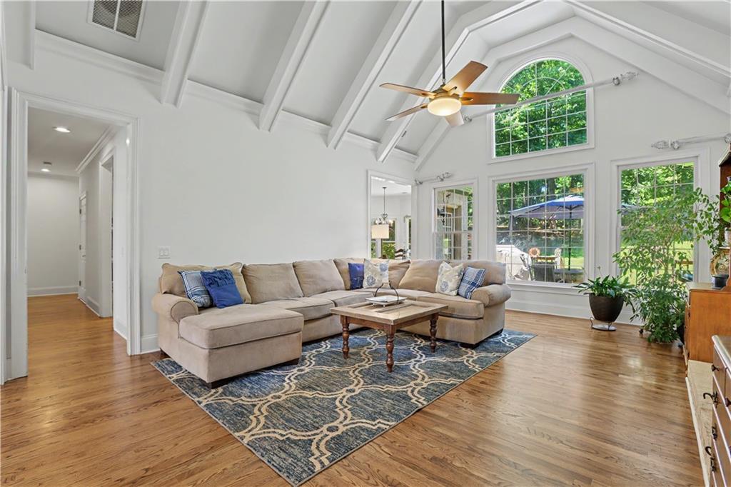 537 Old Collins Road Hoschton, GA 30548 - Photo 11 of 42 a living room with furniture and a large window