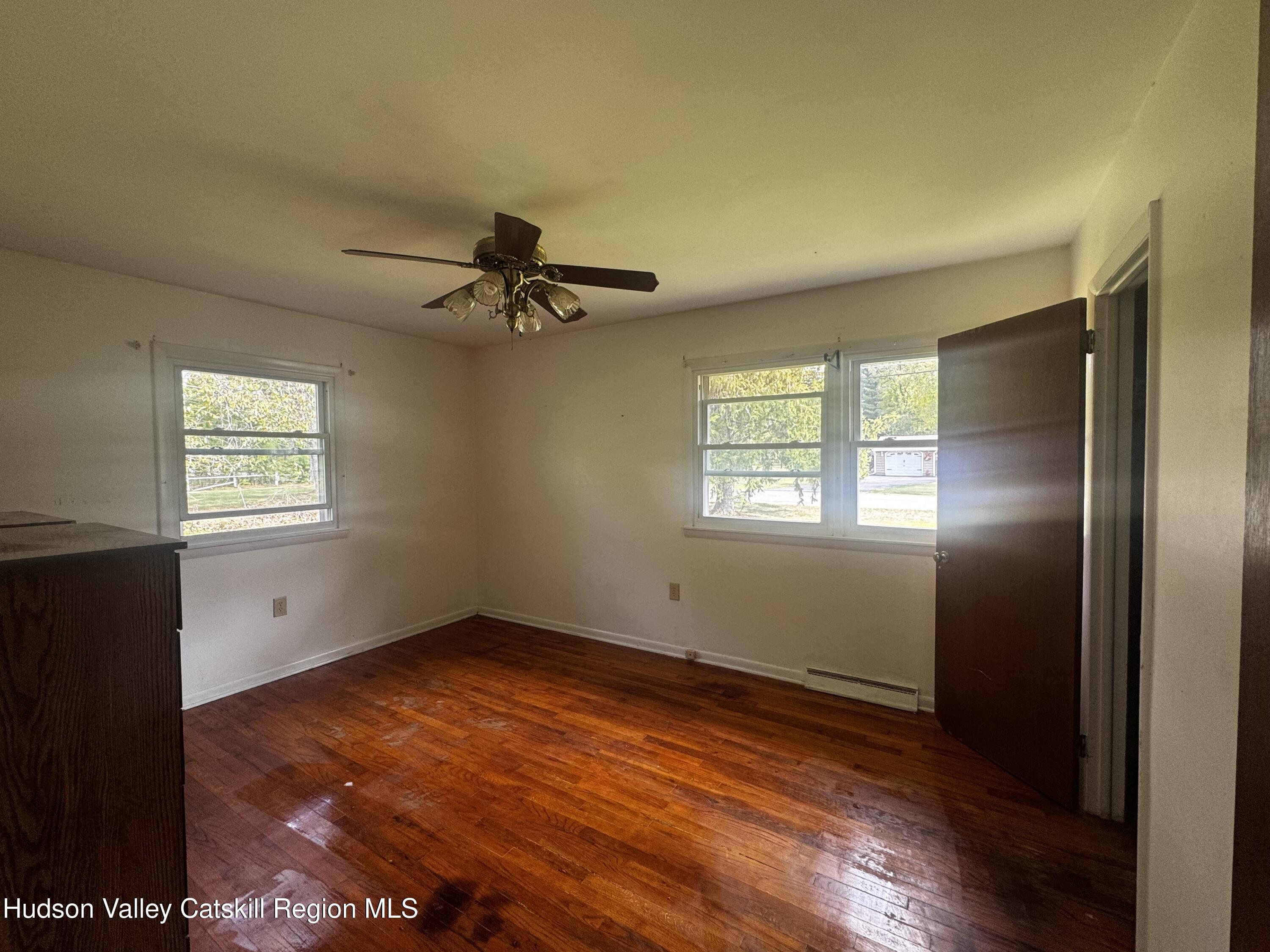 14 Snyder Circle Stone Ridge, NY 12484 - Photo 8 of 19 wooden floor in an empty room with a window