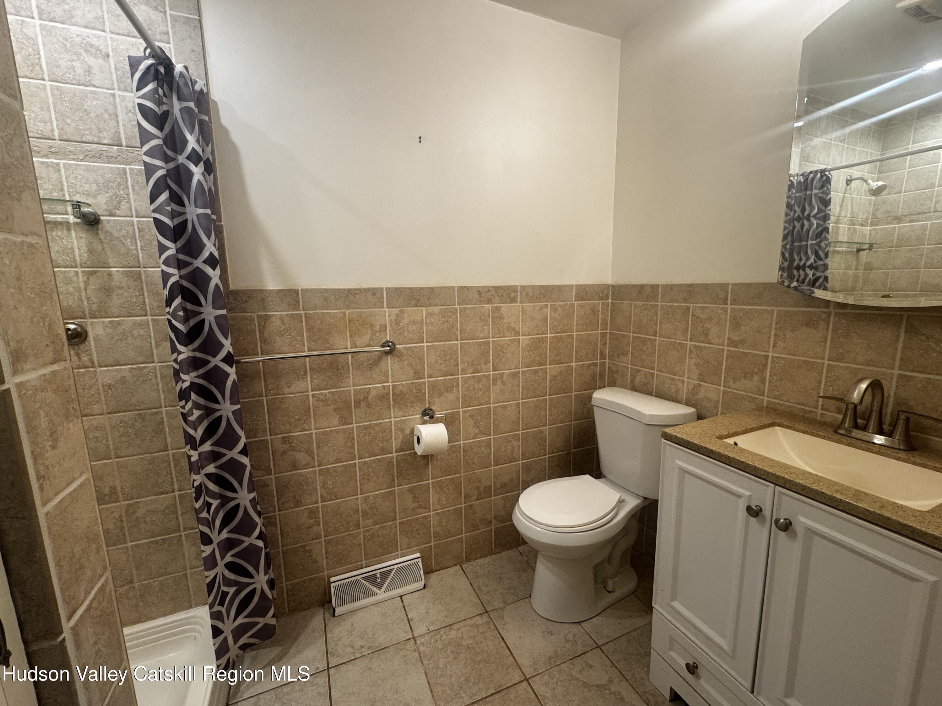 14 Snyder Circle Stone Ridge, NY 12484 - Photo 10 of 19 a bathroom with a sink and a toilet