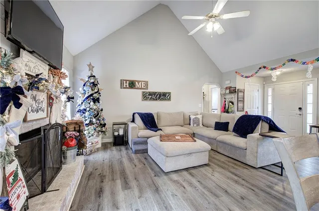 a living room with furniture and a flat screen tv