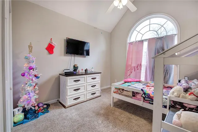 a living room with baby crib and furniture