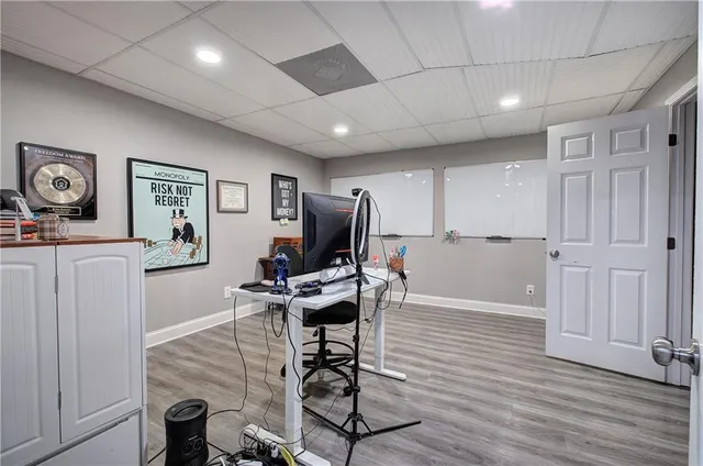 a view of a livingroom with furniture and wooden floor